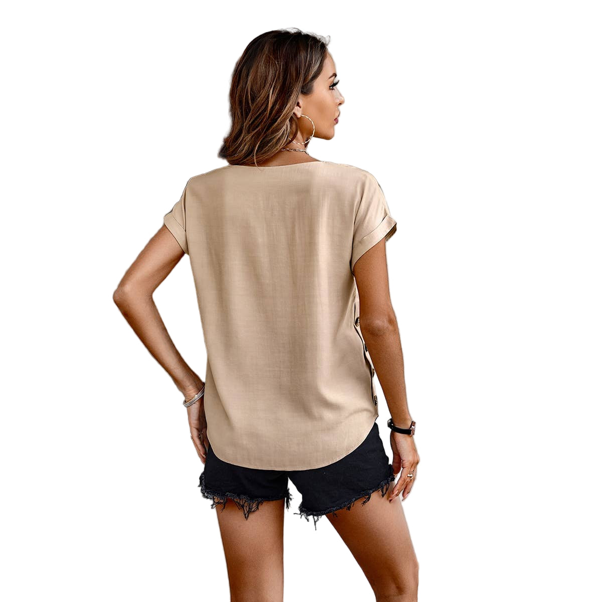 Woman wearing a beige t-shirt and black shorts on a white background